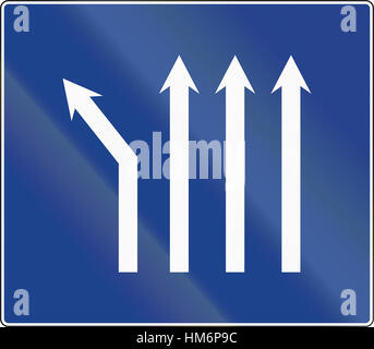 Road sign used in Spain - Fork left at four-lane road. Stock Photo