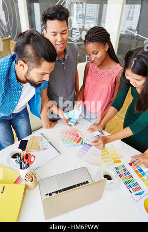 Young founders team participating in creative workshop in teamwork Stock Photo