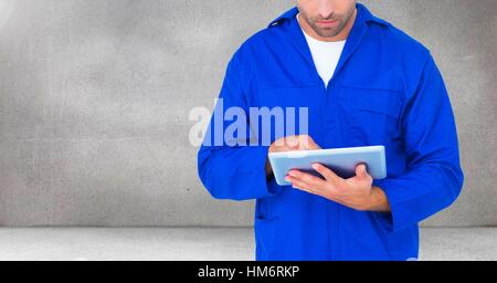 Serviceman using digital tablet Stock Photo
