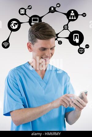 Smiling doctor using mobile phone with application icon Stock Photo
