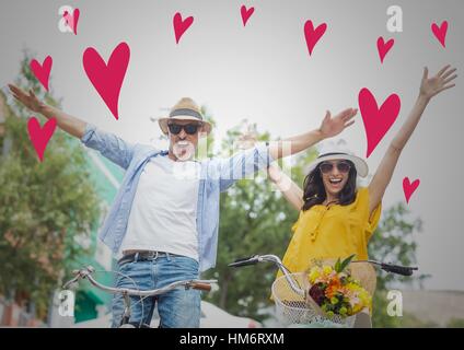 Cheerful couple on bicycles Stock Photo