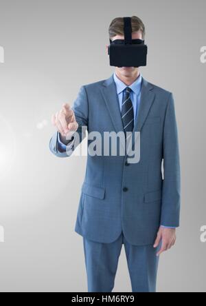 Businessman using virtual reality headset Stock Photo