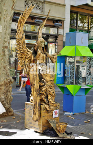 BARCELONA,ES - CIRCA JULY, 2008 - Performing artists exhibit along La Rambla, the famous street in Barcelona. Stock Photo