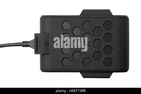 Black external hard drive with the inserted cable. Top view. Portable disk is isolated on a white background Stock Photo