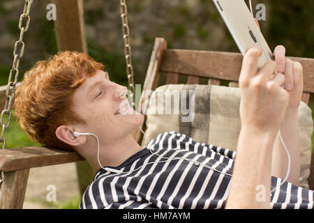 Boy using an i pad Stock Photo