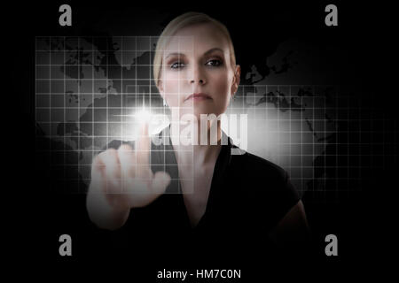 Mature woman touching virtual screen Stock Photo
