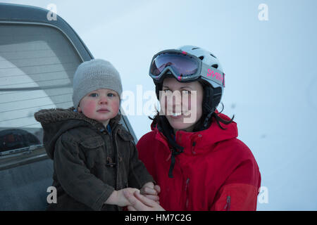 Mother and young son enjoying Mount Olympus ski resort in Canterbury, New Zealand Stock Photo