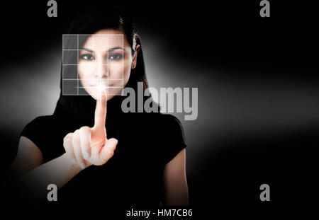 Woman touching virtual screen Stock Photo