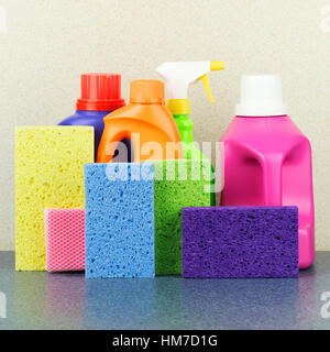 Detergent bottles and sponges Stock Photo