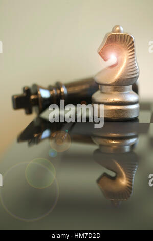 Chess pieces reflecting in board Stock Photo