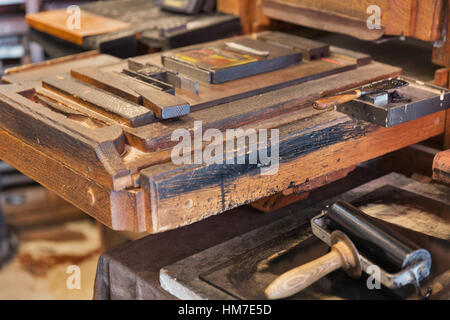 BLED, SLOVENIA - SEPTEMBER 07, 2015: Medieval wooden printing machine closeup in Bled Castle. Castle is situated in Julian Alps of Upper Carniolan reg Stock Photo