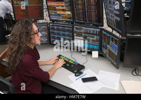 Young trader analyzing computer data Stock Photo
