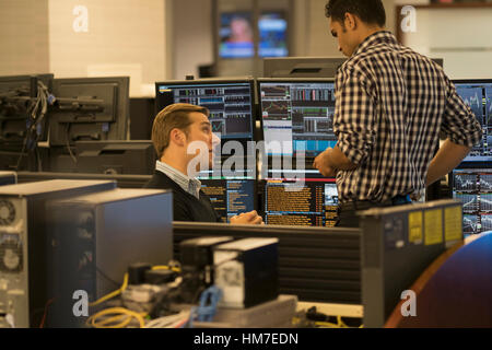 Young traders working in stock market Stock Photo