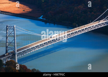 USA, New York, Bear Mountain with bridge above blue river Stock Photo