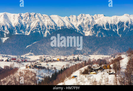 winter landscape in Romania, Piatra Craiului mountain seen from Rucar- Bran highway Stock Photo
