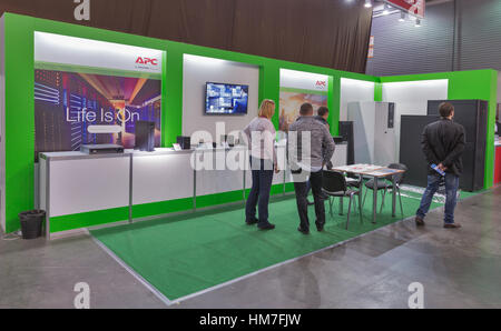 KIEV, UKRAINE - OCTOBER 11, 2015: People visit Schneider Electric, France electronics manufacturer booth during CEE 2015, the largest electronics trad Stock Photo