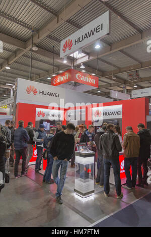 KIEV, UKRAINE - OCTOBER 11, 2015: People visit Huawei, Chinese  electronics manufacturer company booth during CEE 2015, the largest electronics trade  Stock Photo
