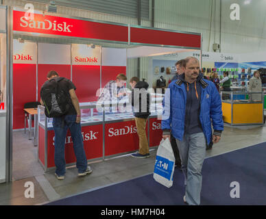 KIEV, UKRAINE - OCTOBER 11, 2015: People visit SanDisk, American electronics manufacturer company booth during CEE 2015, the largest electronics trade Stock Photo