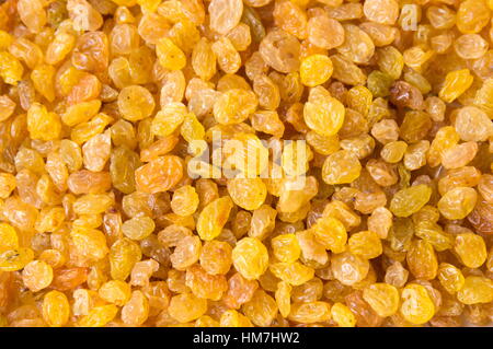 Bunch of yellow raisins forming a background pattern Stock Photo