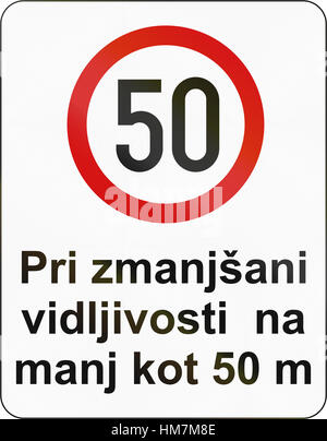 Slovenian road sign - The text means: Speed limit when visibility reduced to 50 meters. Stock Photo