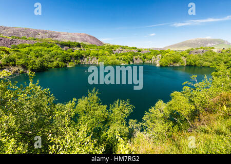 Looking across the disused Dorothea Slate Quarry, Nantlle, Gwynedd, Wales, United Kingdom. Flooded with water. Stock Photo