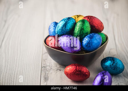 Decorative colourful easter eggs in metallic wrapping Stock Photo