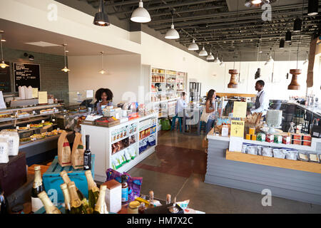Interior Of Busy Delicatessen With Customers Stock Photo
