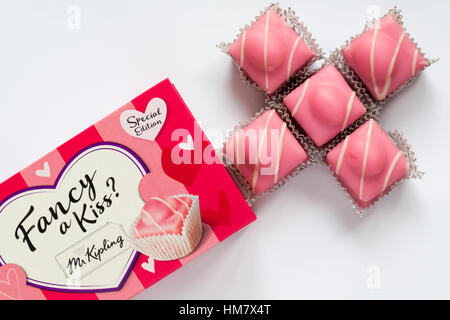 Packet of Fancy a Kiss Fondest Fancies cakes by Mr Kipling just in time for Valentines day with contents arranged in shape of kiss on white background Stock Photo