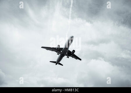 aircraft approach during sundown Stock Photo