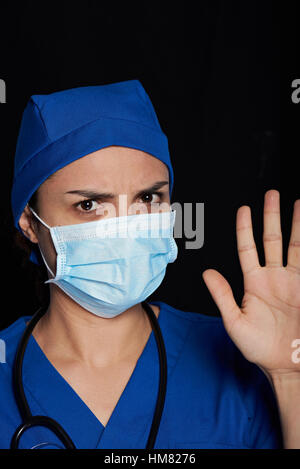 portrait of strict woman doctor isolated on black