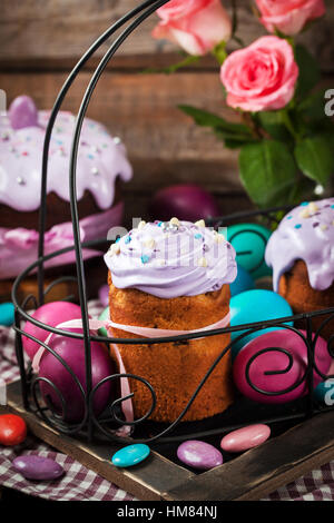 Delicious homemade holiday Easter cakes and colored eggs around Stock Photo