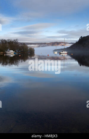 Hamlet of Aldochlay, Scotland. Leisure boats moored by the banks of Loch Lomond near the hamlet of Aldochlay. Stock Photo
