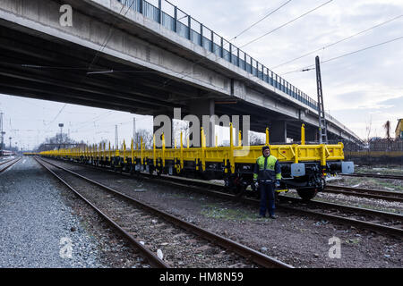 Burgas, Bulgaria - January 27, 2017 - Freight cargo train - 4-axled flat wagon Type:Res Model:072-2 - Transvagon AD Stock Photo