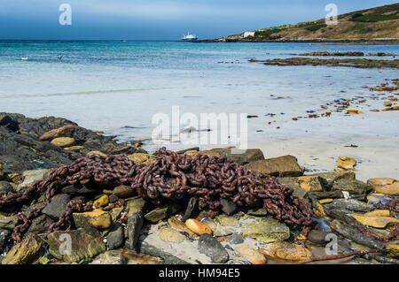 Rusty chain on a beach, Carcass Island, Falkland Islands, South America Stock Photo