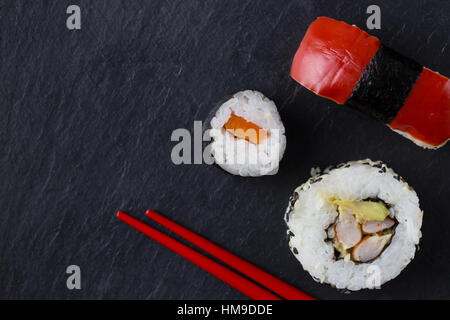 Sushi pieces and chopsticks Stock Photo