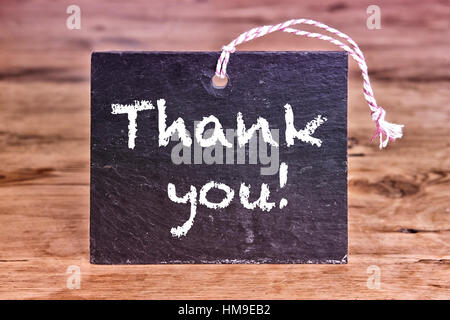 Thank You written on chalkboard on wooden table Stock Photo