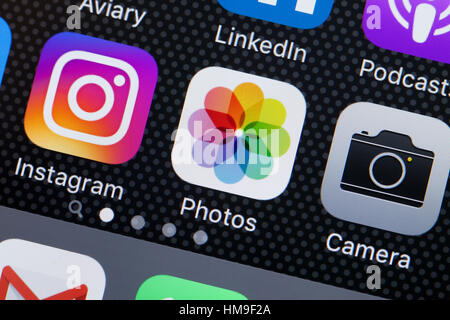 Photos app icon on iPhone screen - USA Stock Photo