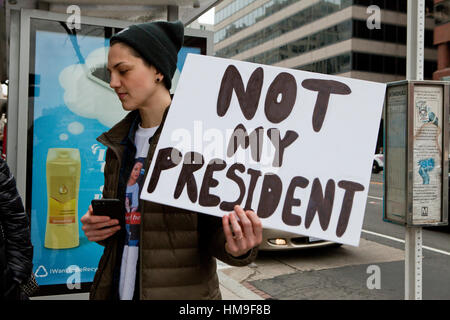 Jan. 20th, 2016, Washington, DC USA: Woman holding 'Not My President' sign during 2017 presidential inauguration protest