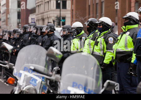 Metropolitan Police standing in formation against protesters during 2017 Presidential Inauguration - Washington, DC USA Stock Photo