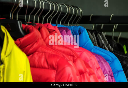 Colorful collection of women's clothes hanging on a rack Stock Photo