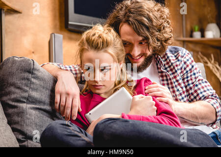Couple sitting together Stock Photo