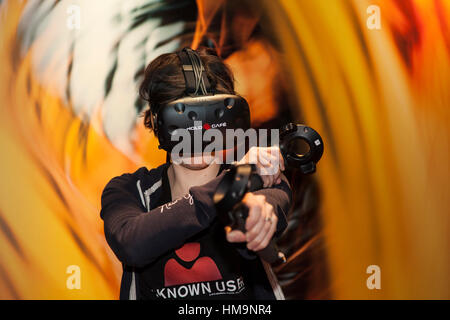 The world of the Virtual Reality - 3D Gaming with a VR gaming headset Stock Photo