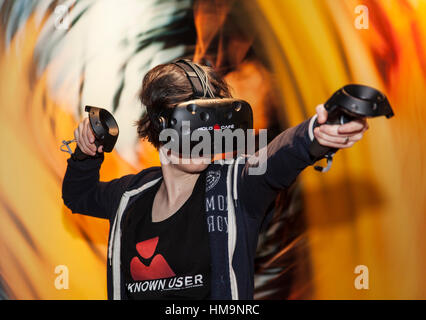 The world of the Virtual Reality - 3D Gaming with a VR gaming headset Stock Photo