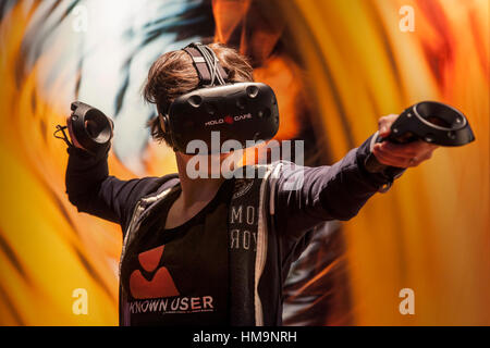 The world of the Virtual Reality - 3D Gaming with a VR gaming headset Stock Photo