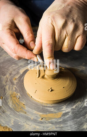 Ceramic workshop, hands shaping lid of pot on pottery wheel, Pittenhart, Upper Bavaria, Germany Stock Photo