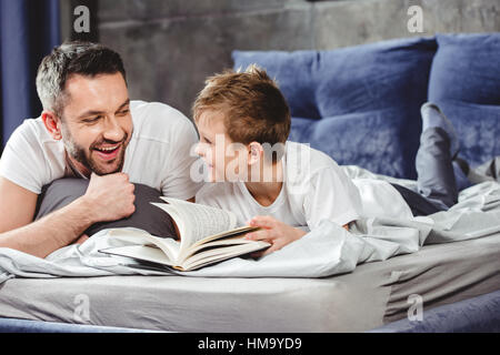 Father and son reading book Stock Photo