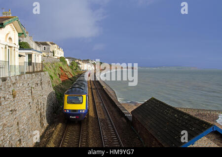 A First Great Western Class 43 High Speed Train between Dawlish and Dawlish Warren, Devon.  In the background is Langstone Rock. Stock Photo