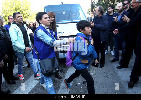 Athens, Greece. 2nd Feb, 2017. Refugee children arrive at an elementary school at Perama district of Piraeus port, Greece, on Feb. 2, 2017. The children were warmly welcomed during the start of afternoon classes. Two weeks ago at the same school a far-right protest had obstructed the lessons. Credit: Marios Lolos/Xinhua/Alamy Live News Stock Photo