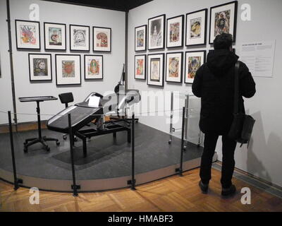 New York, USA. 01st Feb, 2017. A visitor standing in the exhibition 'Tattooed New York' on the history and art of tattooing in New York in the Historical Society in New York, US, 01 February 2017. Photo: Johannes Schmitt-Tegge/dpa/Alamy Live News Stock Photo