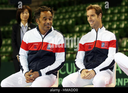 Tokyo, Japan. 2nd Feb, 2017. French team captain yannick Noah (L) smiles with Richard gasquet as they attend a drawing event of the Davis Cup World Group first round tennis matches between Japan and France which will be held February 3 to 5 in Tokyo on Thursday, February 2, 2017. Japan's top player Kei Nishikori, ranked the fifth in the world will not play the games. Credit: Yoshio Tsunoda/AFLO/Alamy Live News Stock Photo
